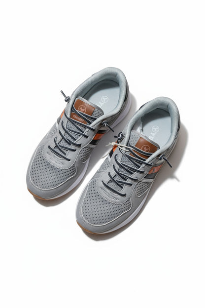 Baskets mixte grises avec détails orange et noir – Style urbain et confort absolu